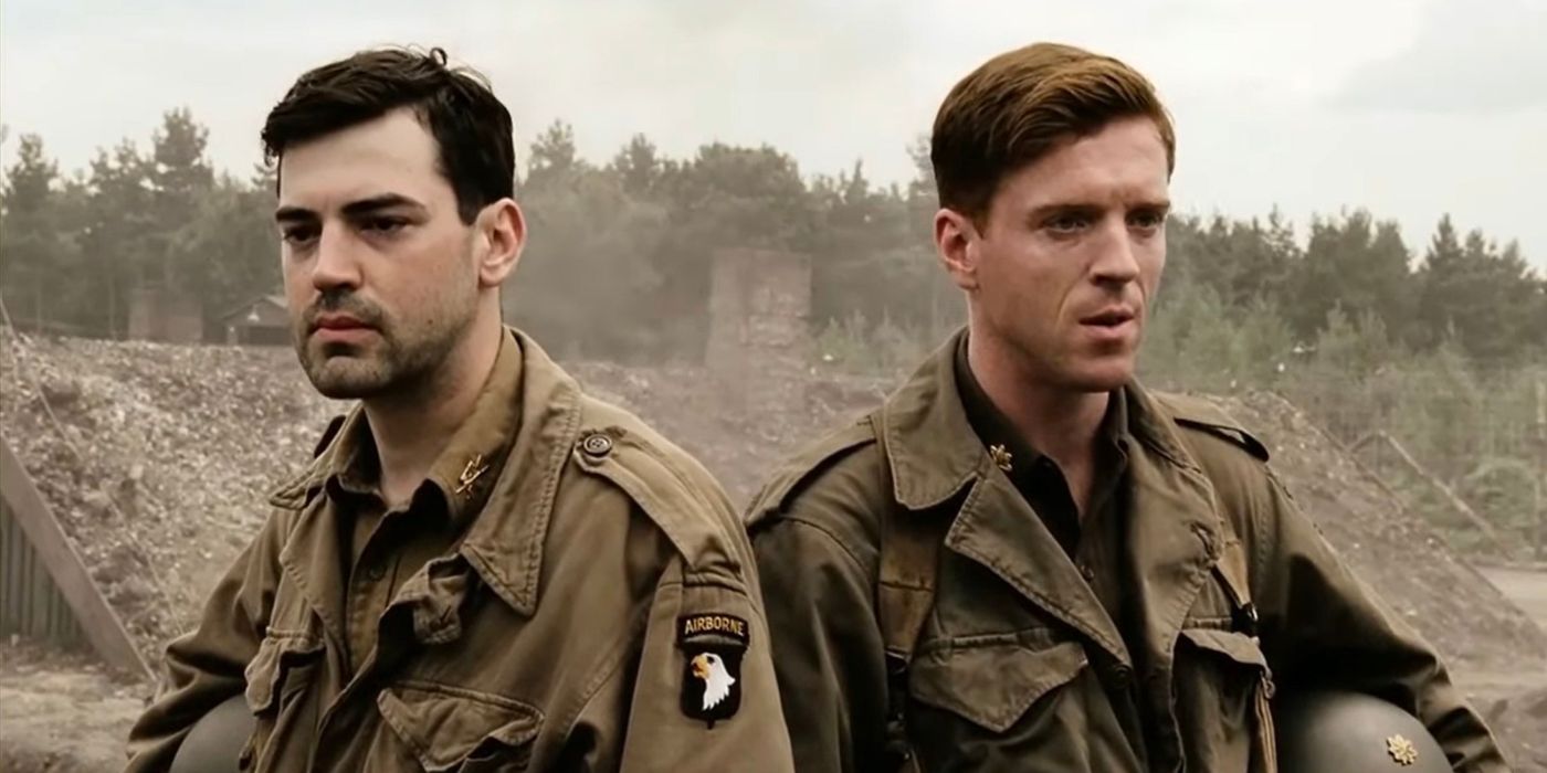 Ron Livingston and Damian Lewis as Captain Lewis Nixon and Major Richard "Dick" Winters stand side by side in Band of Brothers.