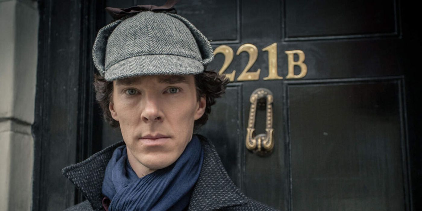 Benedict Cumberbatch as Sherlock outside 221B in the deerstalker hat