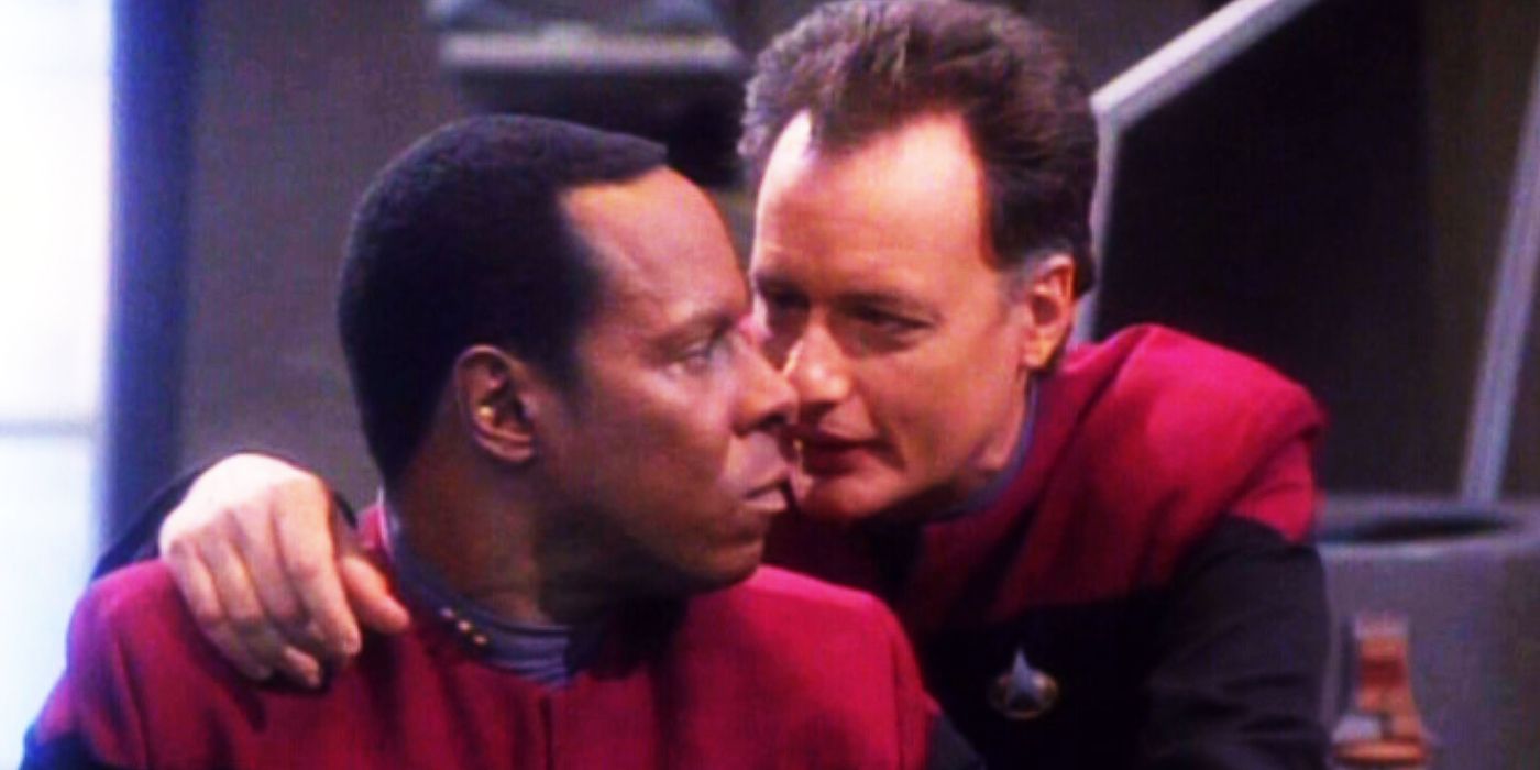 Q whispers in Sisko's ear in Ops