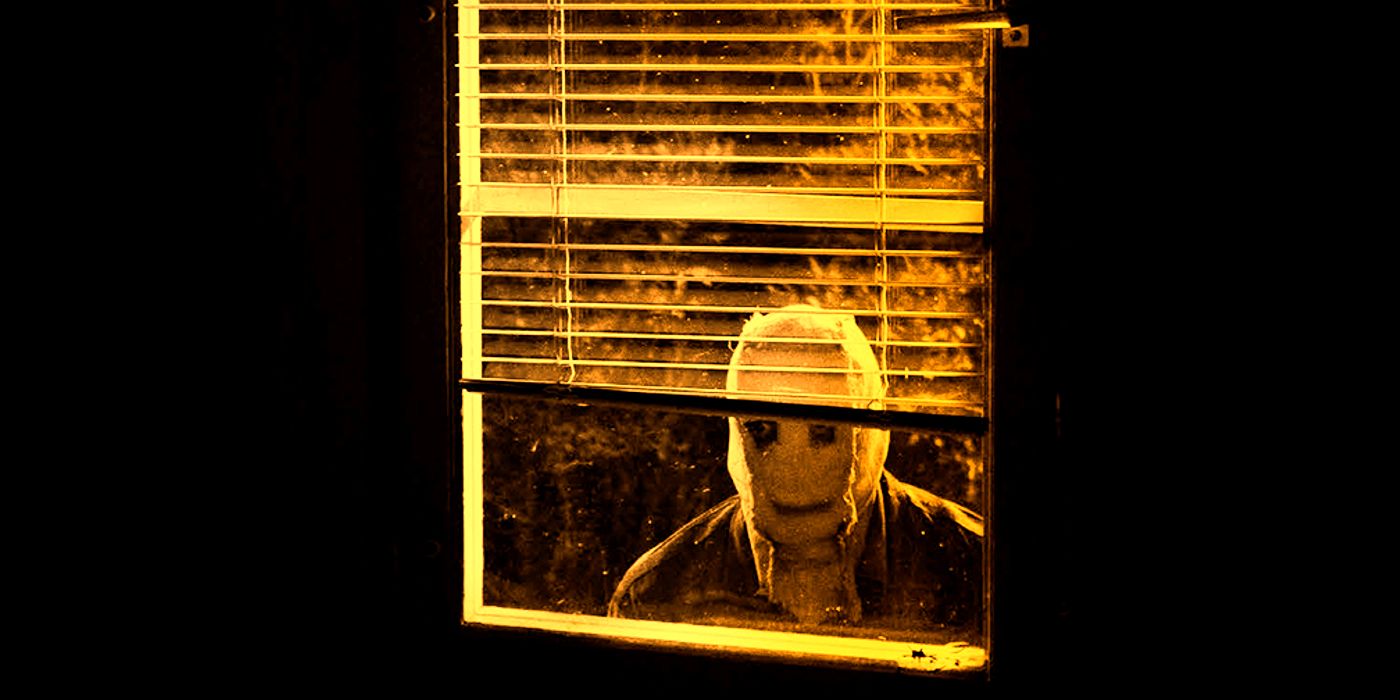 Stranger Staring Through a Window in The Strangers Trilogy Edited