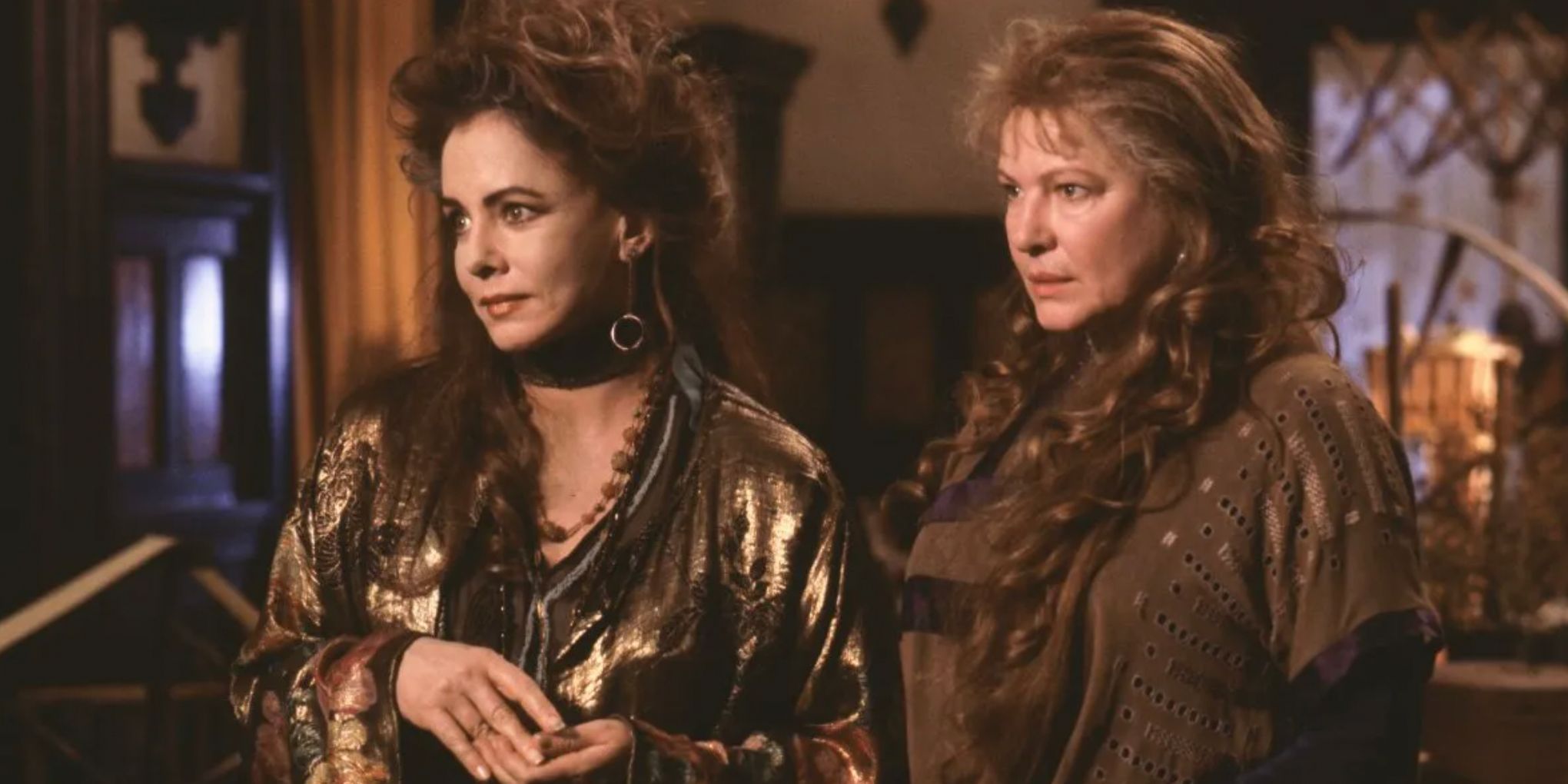The aunts standing together and appearing concerned in Practical Magic