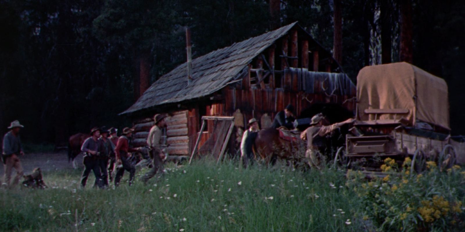 The Hanging Tree shows a log cabin with a wagon outside.
