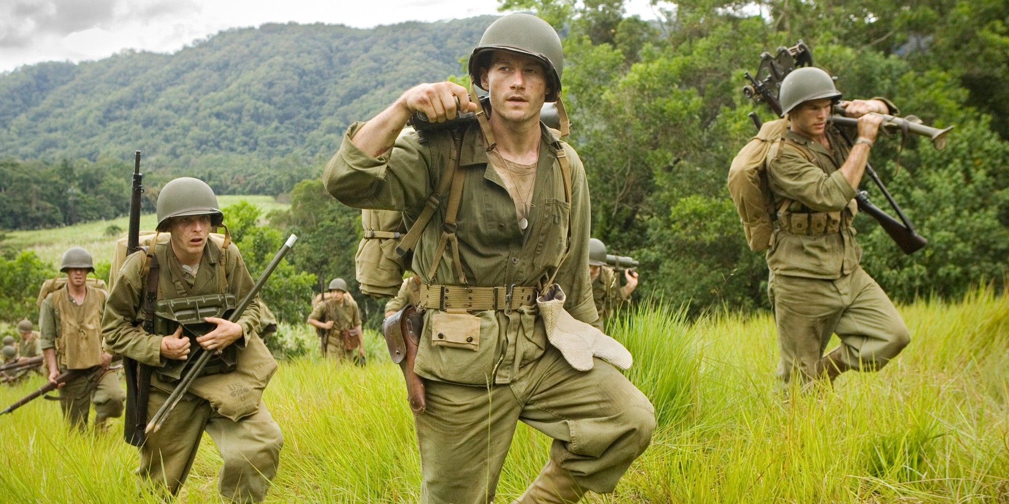 Soldiers walking through long grass in The Pacific Episode 1
