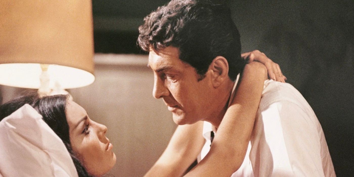 Two people in bed in The Silencers