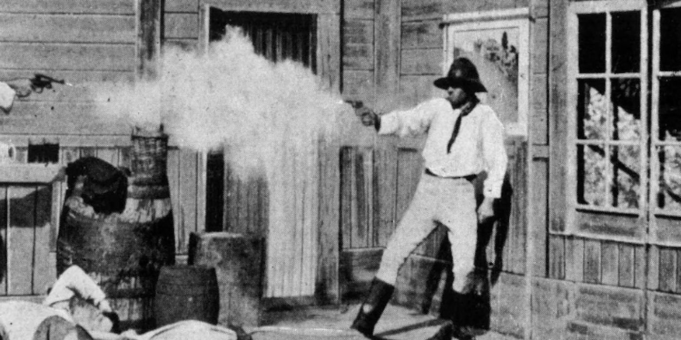 An outlaw shooting a gun in The Story of the Kelly Gang 1906