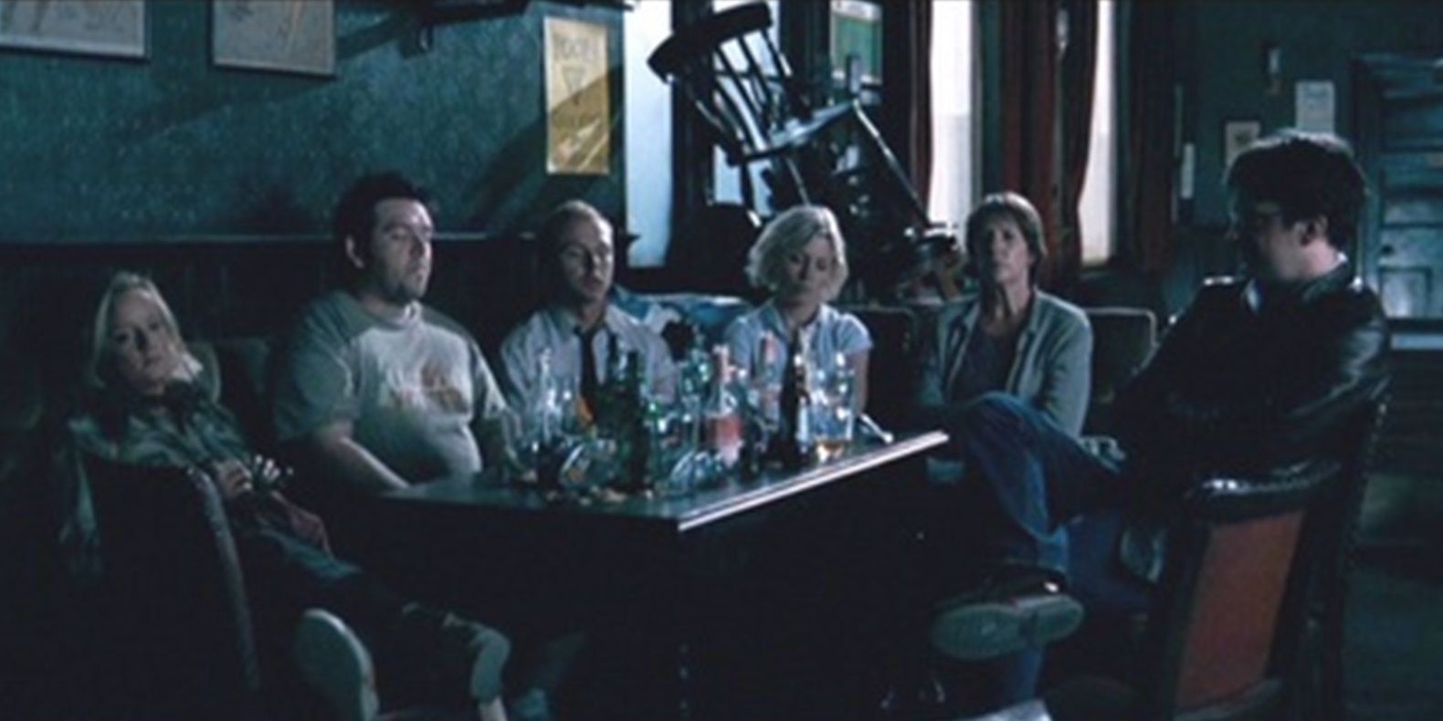 The survivors sit in the dark in Shaun of the Dead