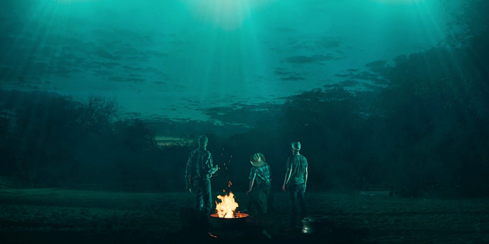 three people looking up at the sky for Netflix’s Encounters