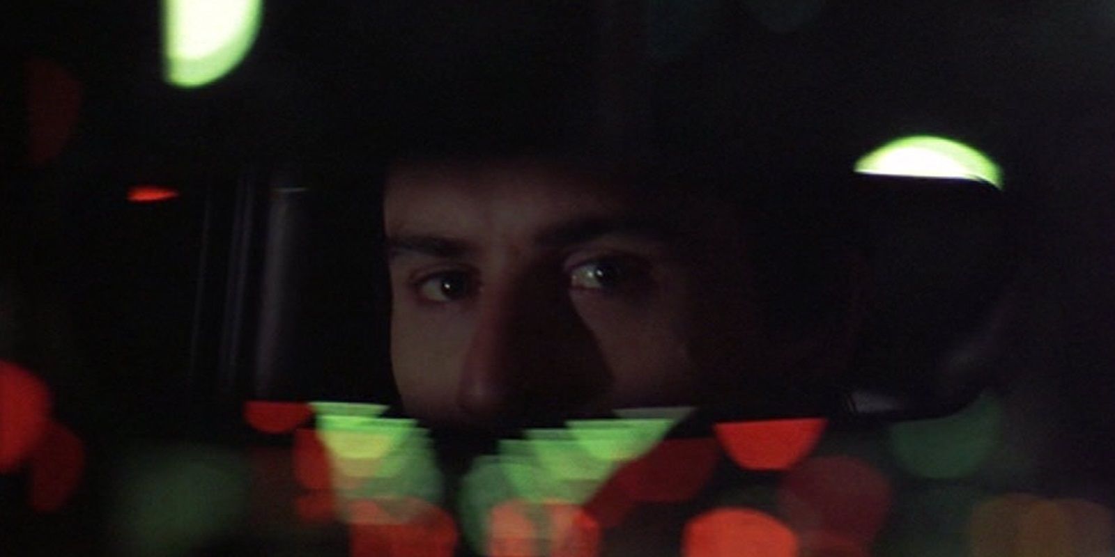 Travis looking in his rearview mirror in Taxi Driver