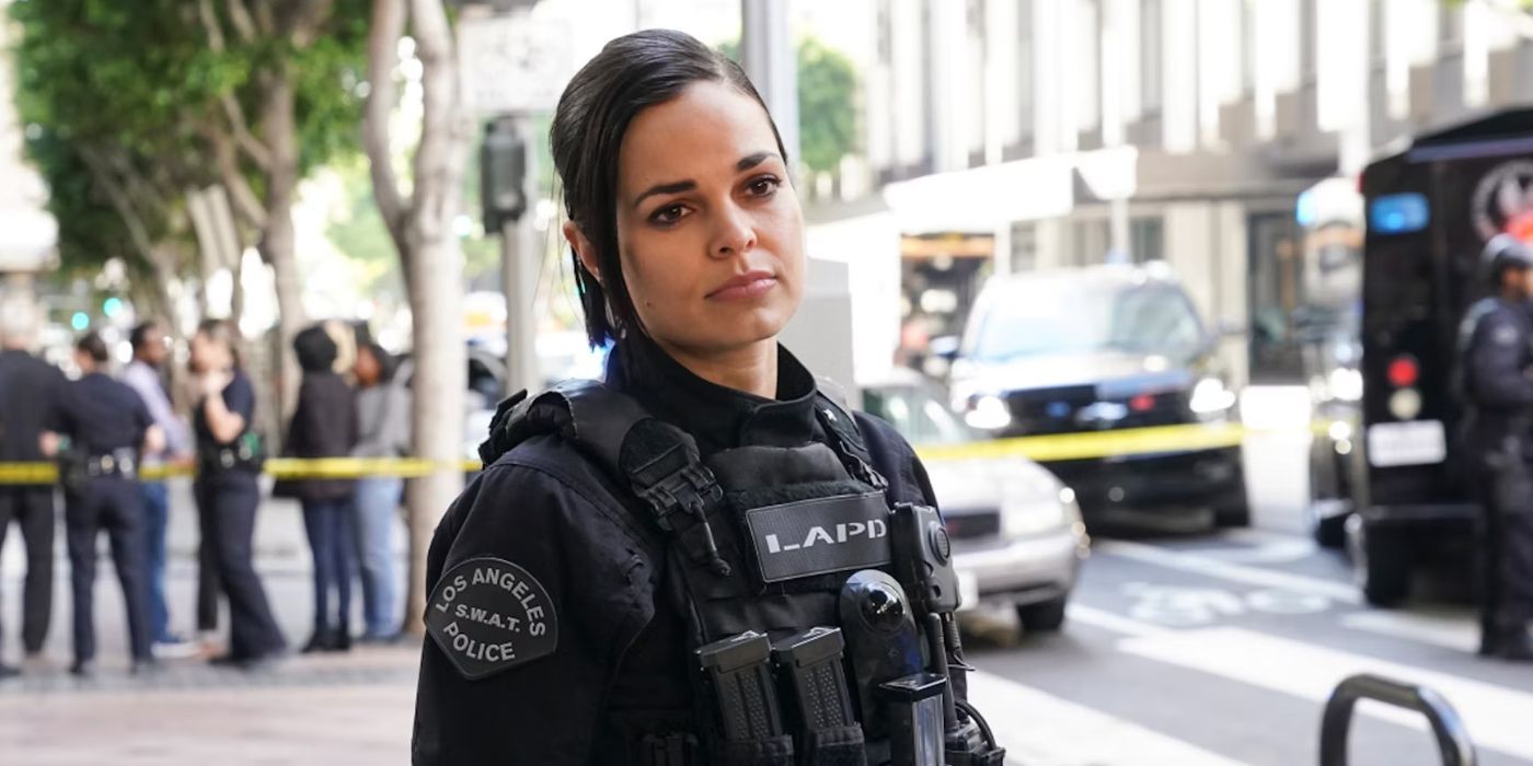 Chris standing on the street in her gear in SWAT