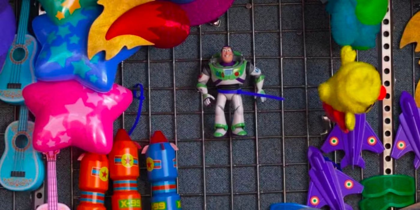 Buzz is strapped to a carnival prize wall. 