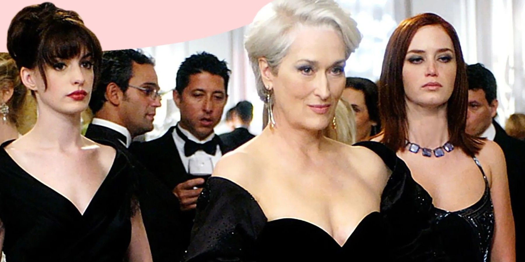 Anne Hathaway and Emily Blunt standing next to Meryl Streep in The Devil Wears Prada