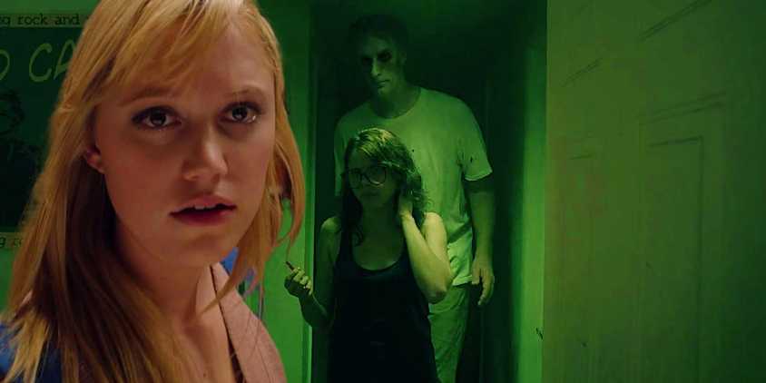 A composite image of Jay (Maika Monroe) looking shocked with the tall entity looming in the doorway in It Follows