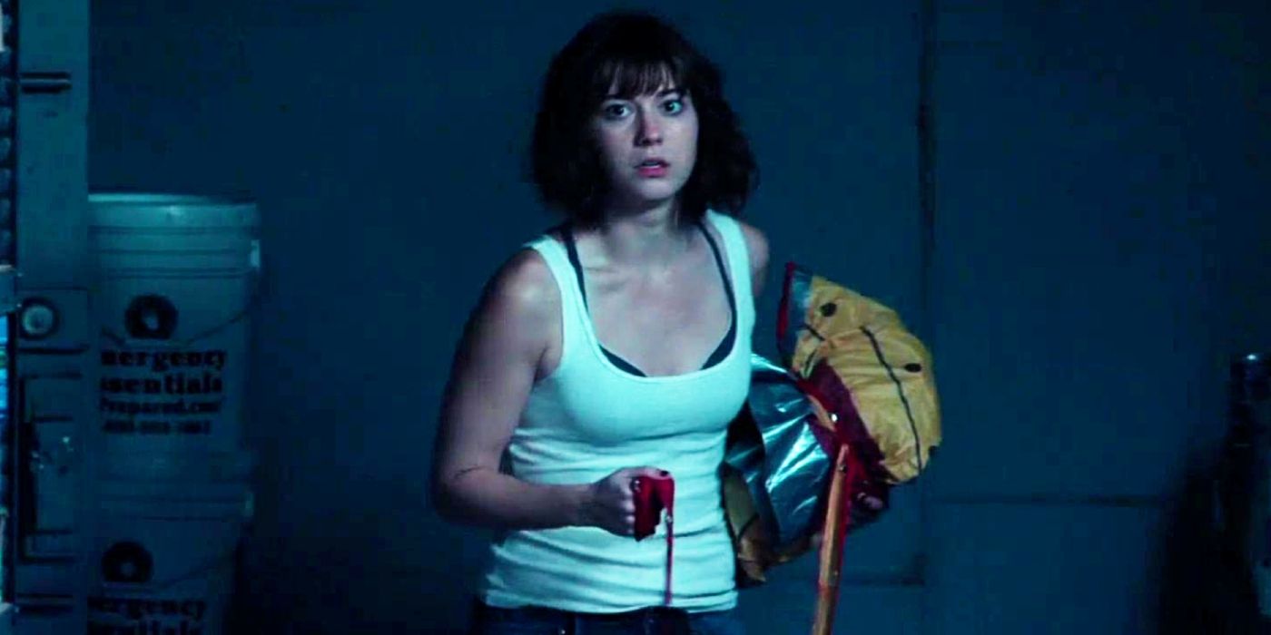 Mary Elizabeth Winstead as Michelle clutching a hazmat suit in 10 Cloverfield Lane.