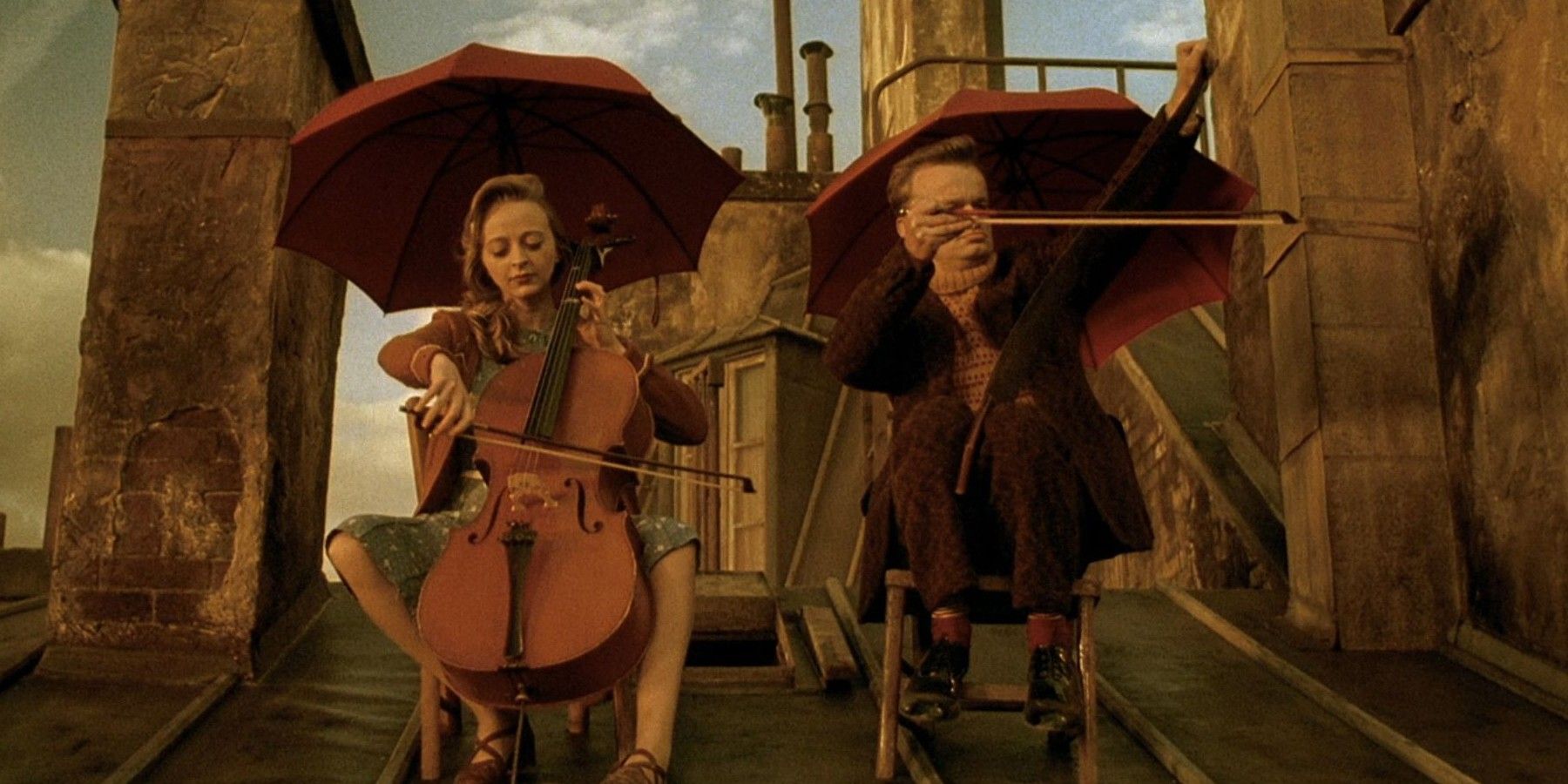 2 charadters playing music on a roof in Delicatessen