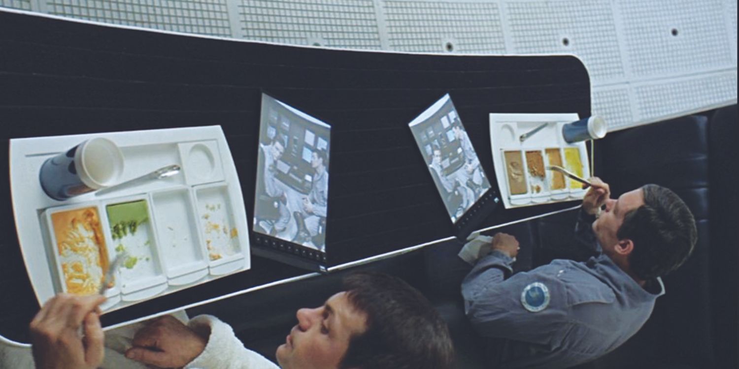 Astronauts eating while watching the news pad/tablet in 2001: A Space Odyssey