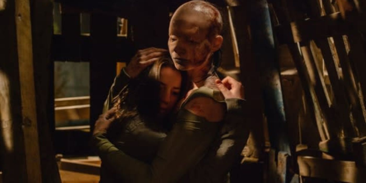 A woman hugging a bald creature in You Are Not My Mother