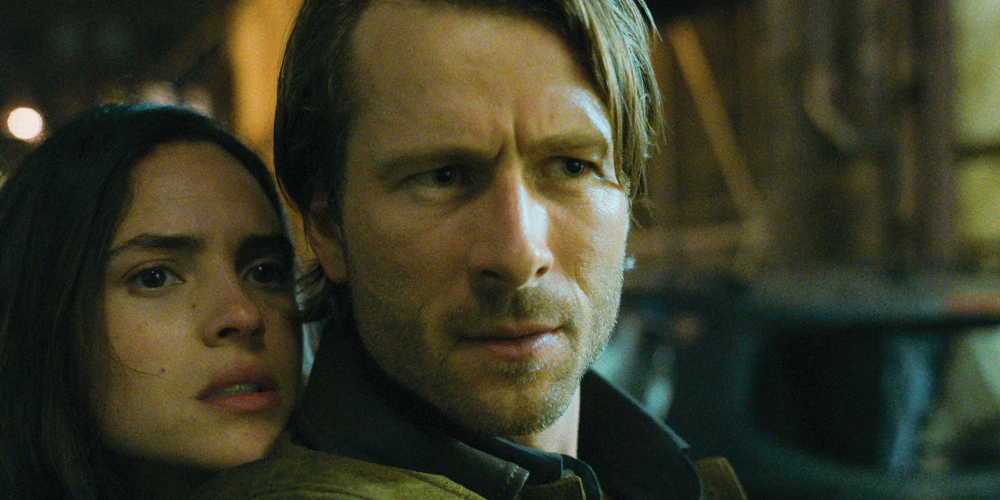 Adria Arjona and Glen Powell in Hit Man