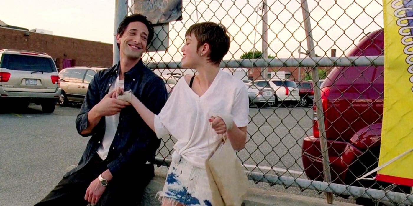 Adrien Brody as Henry Barthes and Sami Gayle as Erica leaning on a fence in Detachment.