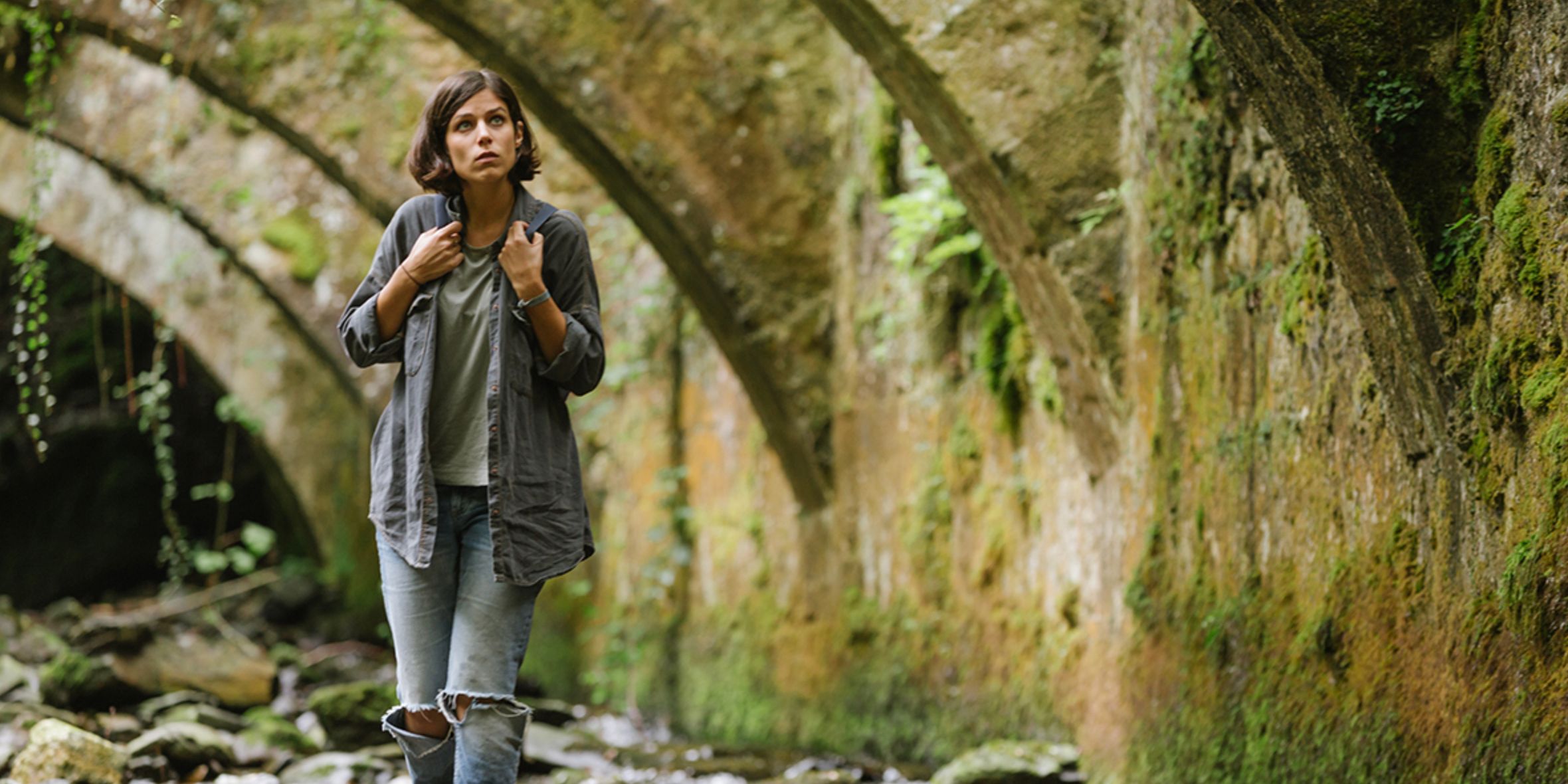 Alba walking under a bridge in The Incredible Shrinking Wknd