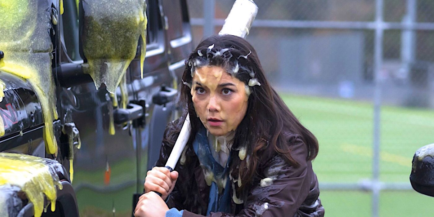 Ana Yi Puig's Isabella wielding a bat and covered in slime in Goosebumps 2023