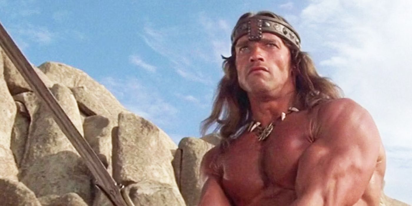 Arnold Schwarzenegger ready for battle with a sword in Conan the Barbarian.