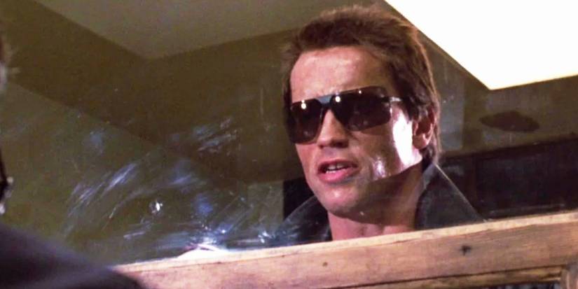 Arnold Schwarzenegger as the T-800 Wearing Sunglasses and Speaking with Himself in the Mirror Saying "I'll Be Back" in The Terminator