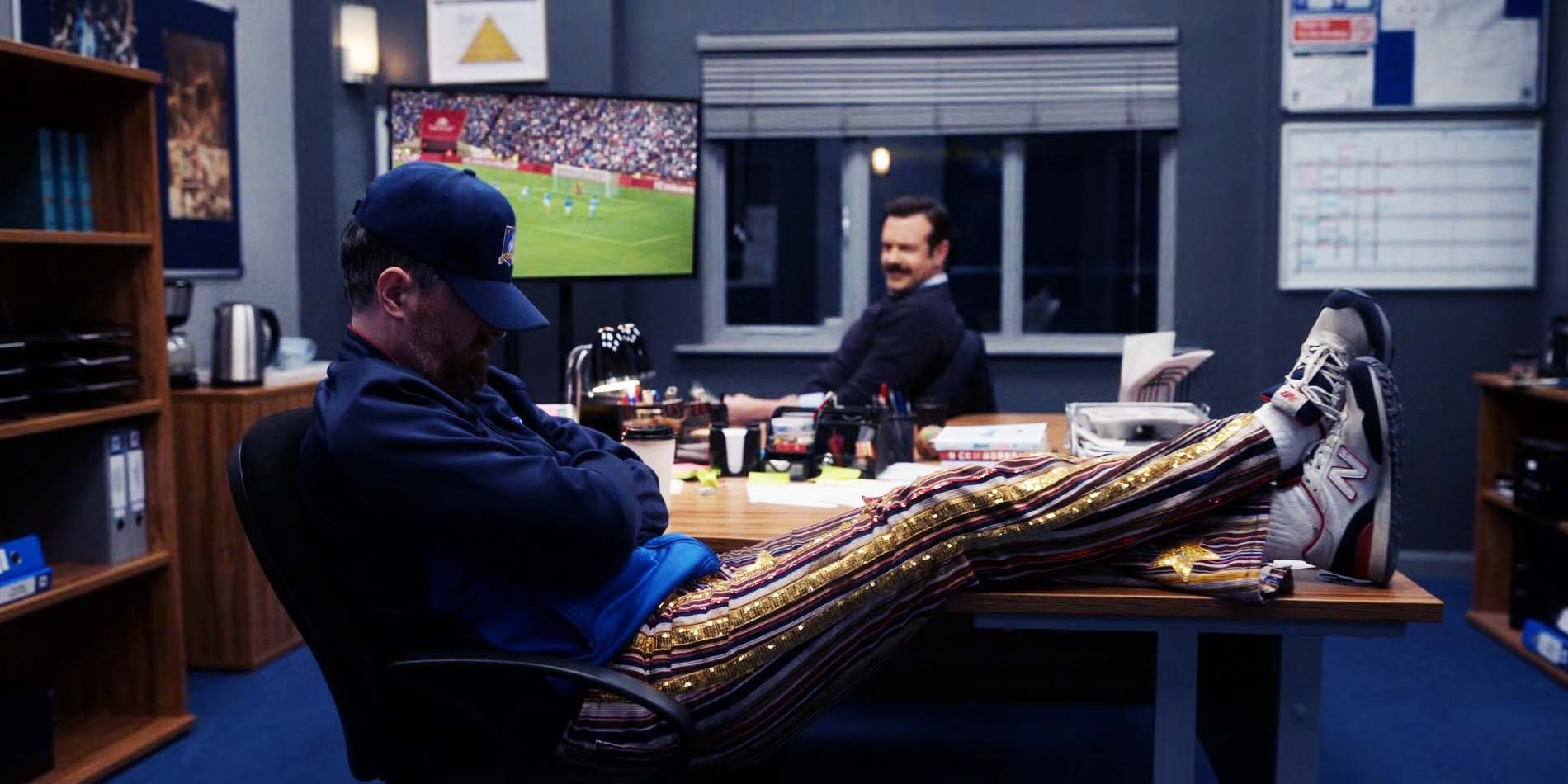 Brendan Hunt as Coach Beard and Jason Sudeikis as Ted Lasso in Ted Lasso season 2 episode 9