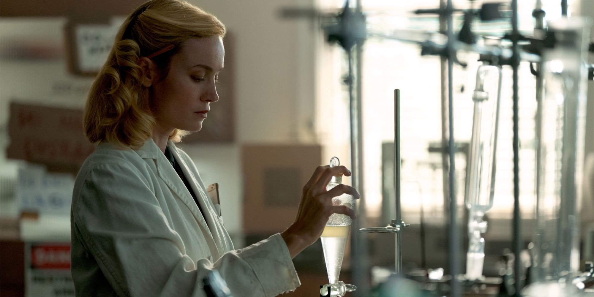 Brie Larson as Elizabeth Zott doing work in the chemistry lab in Lessons in Chemistry