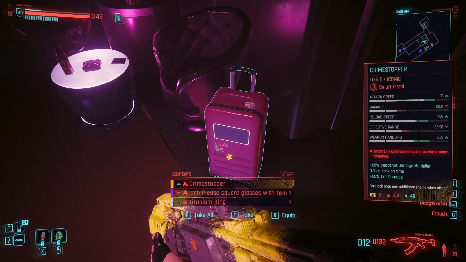 A pink suitcase with a lootable item, the Crimestopper pistol, highlighted in Cyberpunk 2077.