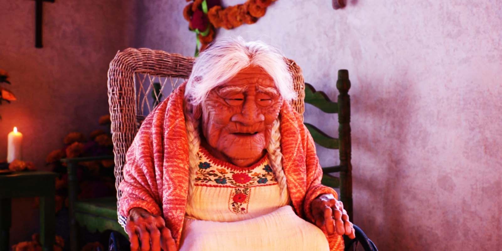 Coco Rivera sitting in a rocking chair in 2017's Coco