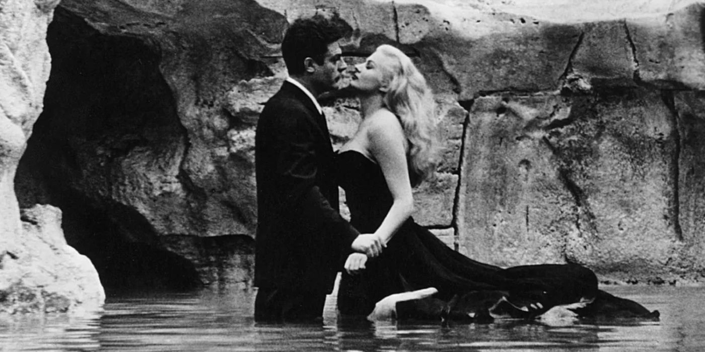 A man and a woman kiss in water in La Dolce Vita