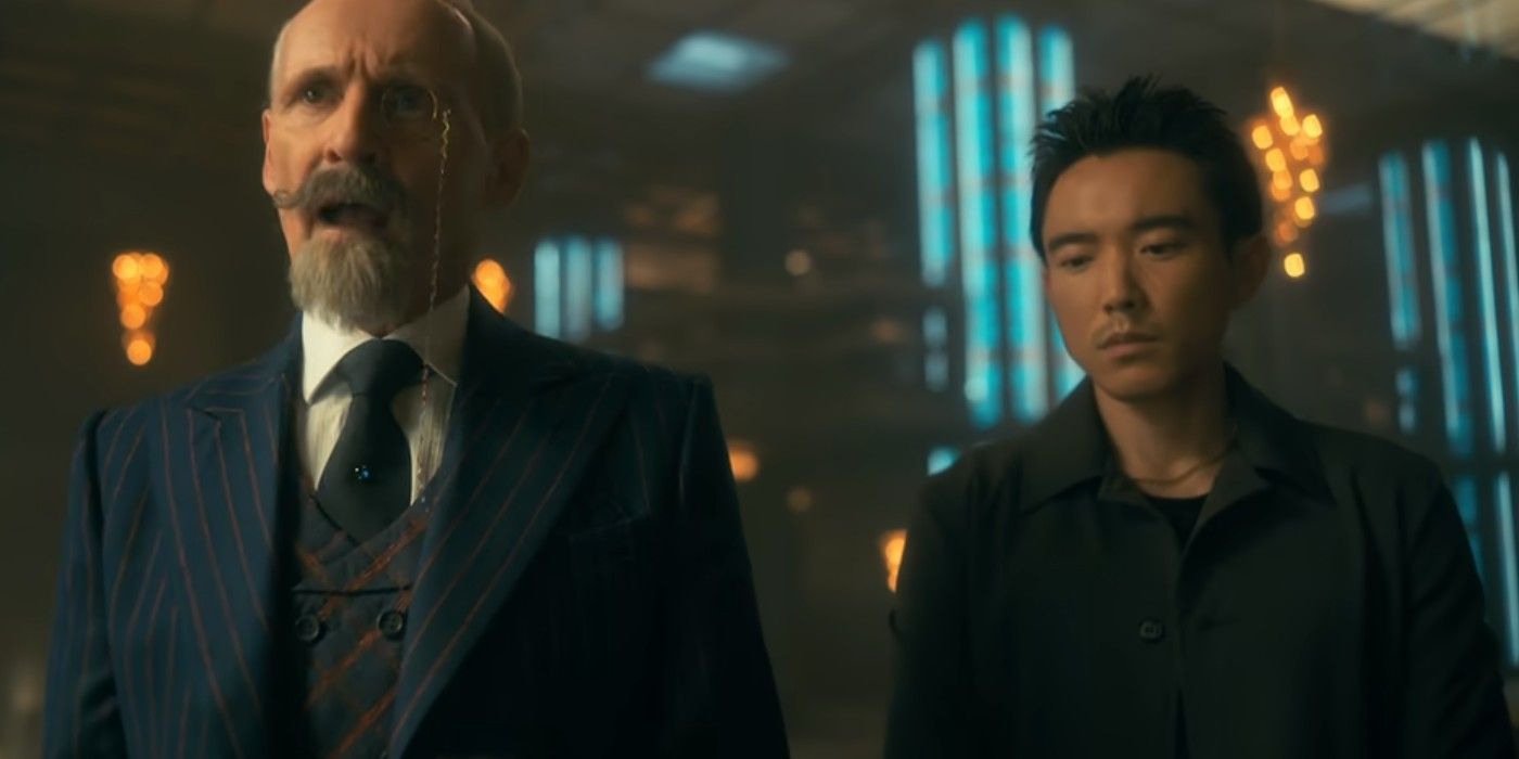 Colm Feore as Sir Reginald Hargreeves with His Mouth Open and Justin H. Min as Ben Looking Sad in The Umbrella Academy