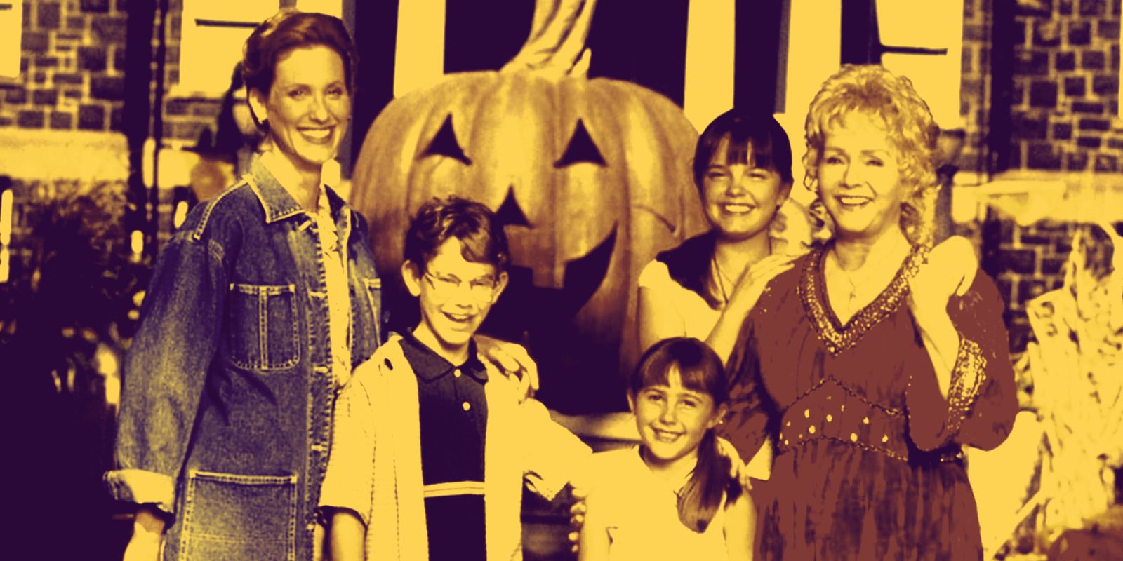 The Cromwell and Piper Family in front of the Halloweentown pumpkin