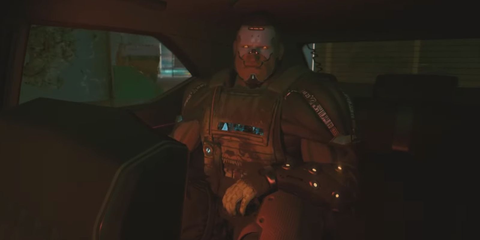 Bennett in the backseat of a car in a screenshot from Cyberpunk 2077: Phantom Liberty.