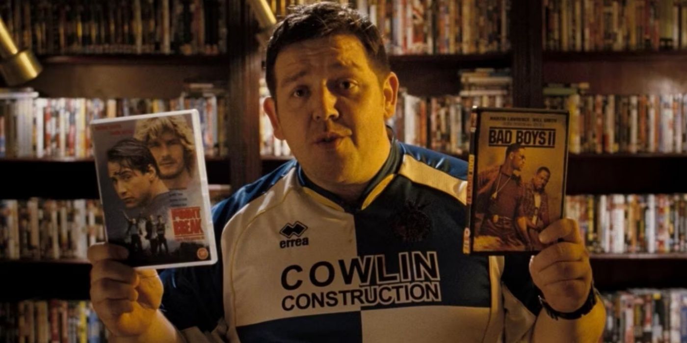 Danny holding Bad Boys 2 and Point Break in Hot Fuzz.