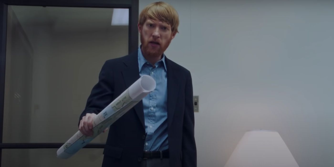 Domhall Gleeson holding a map in his hand in American Made