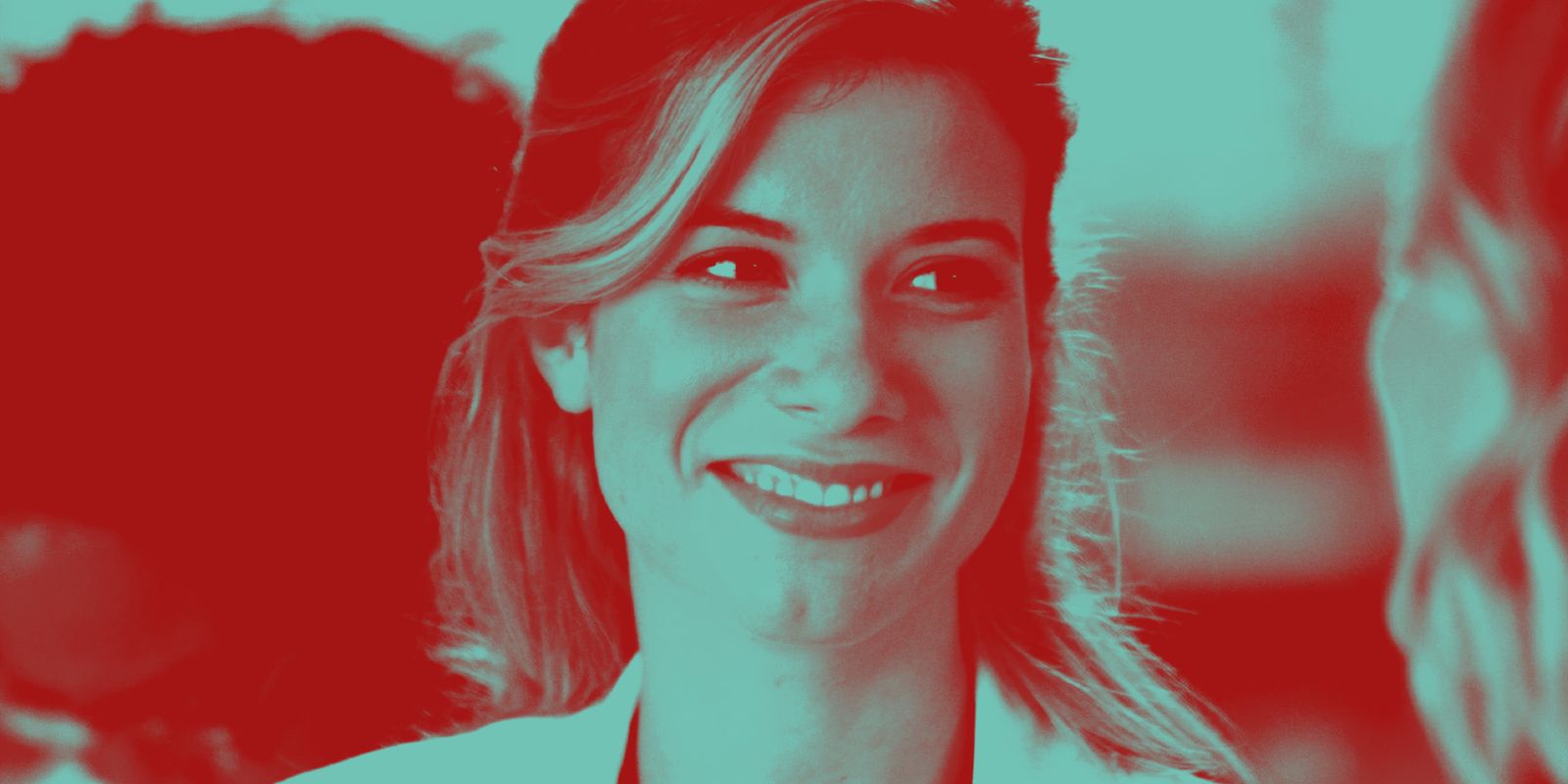 This image shows Tessa Ferrer as Dr. Leah Murphy smiling with a green and red overlay in Grey&rsquo;s Anatomy