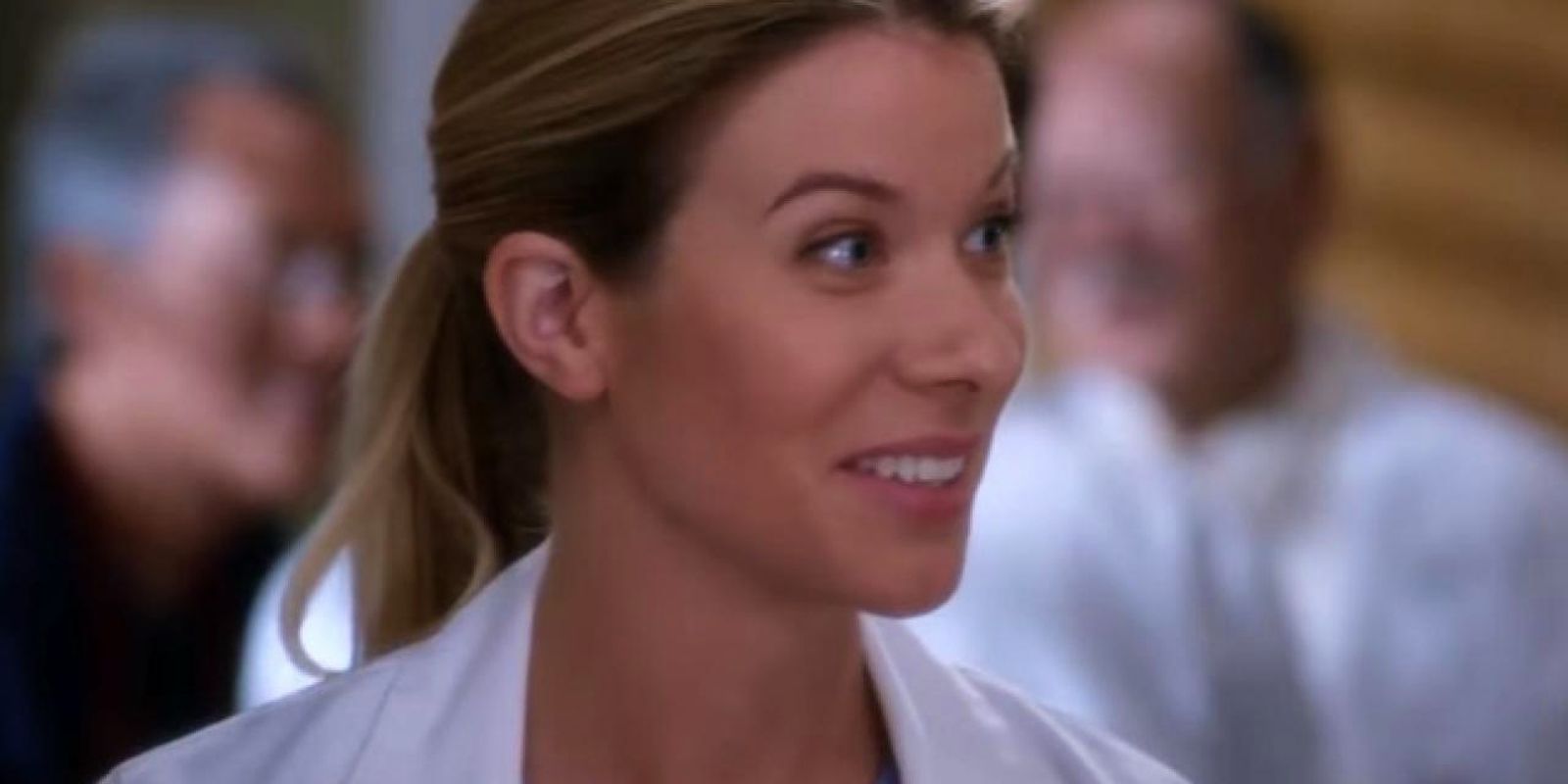 Tessa Ferrer as Dr. Leah Murphy smiling while wearing a white doctor's coat.