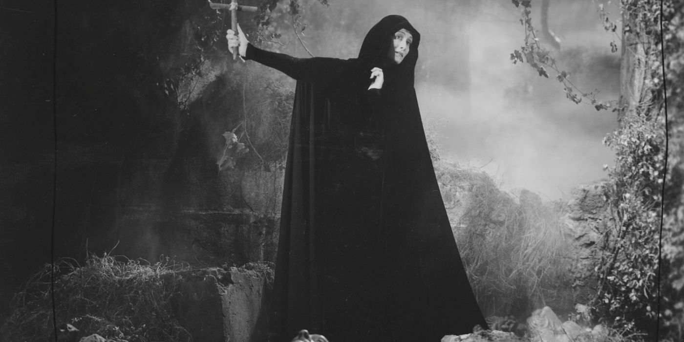 Countess Marya Zaleska swining her arms in a black robe in Dracula's Daughter