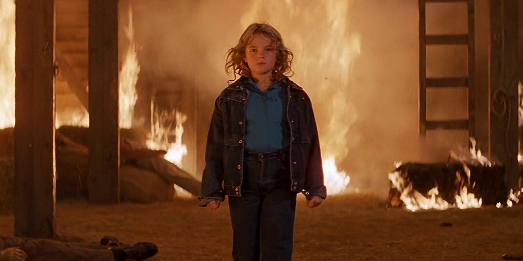 Drew Barrymore in a burning barn in Firestarter