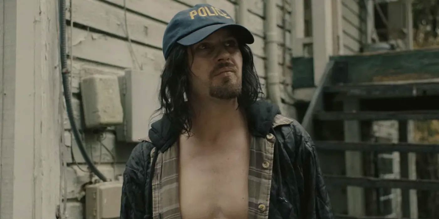 Eli Phillips played by Michael Pitt wearing a Police hat in Reptile