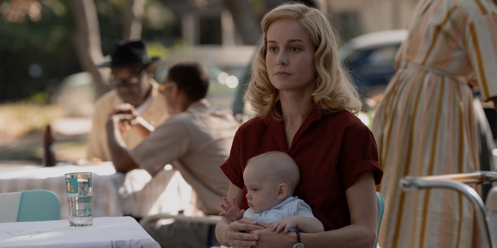 Elizabeth Holding Baby Mad In Her Lap In Lessons In Chemistry Episode 4.jpg