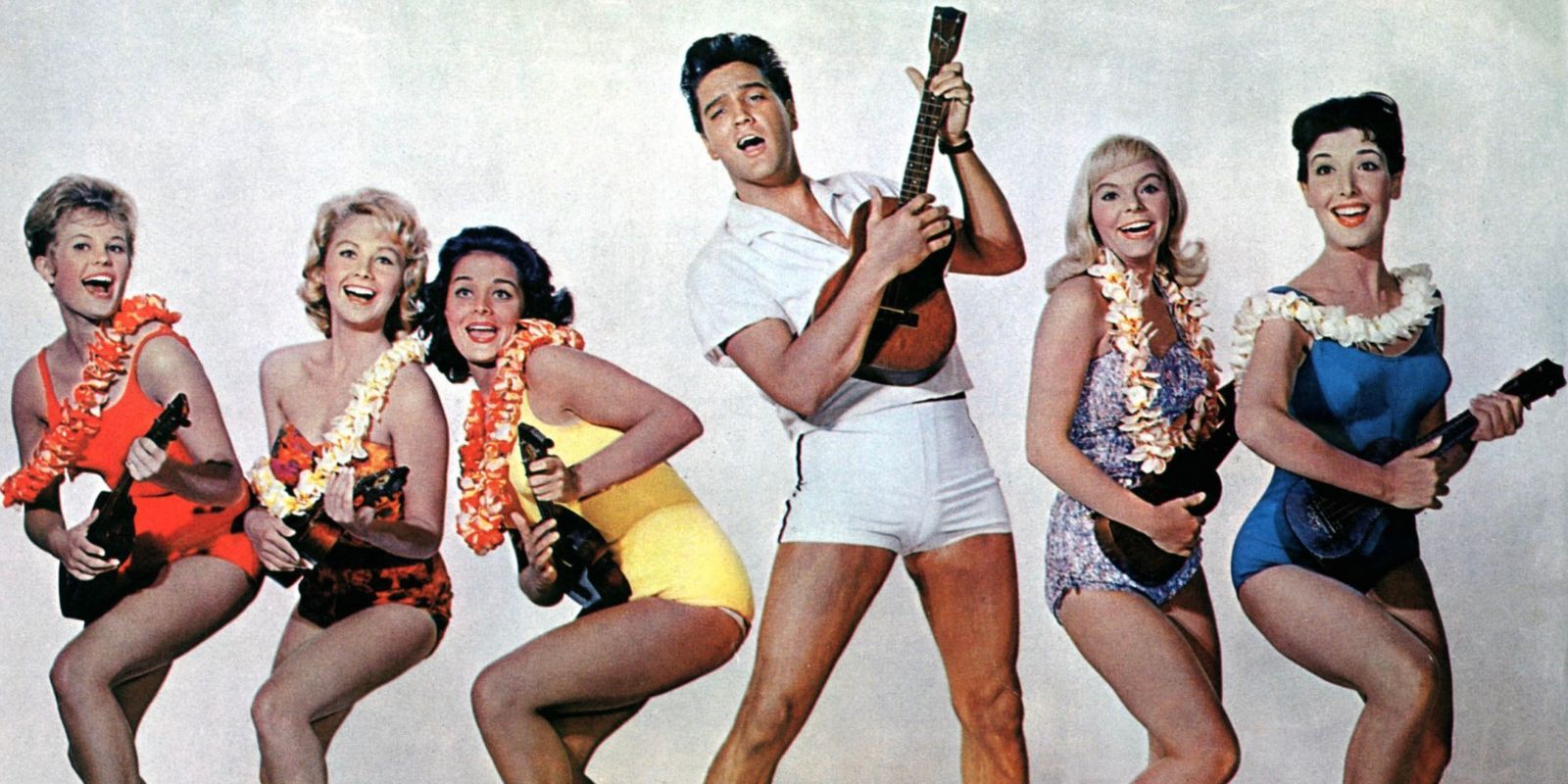 Elvis plus five women in bathing suits and leis all with ukeleles in a promo shot for Blue Hawaii