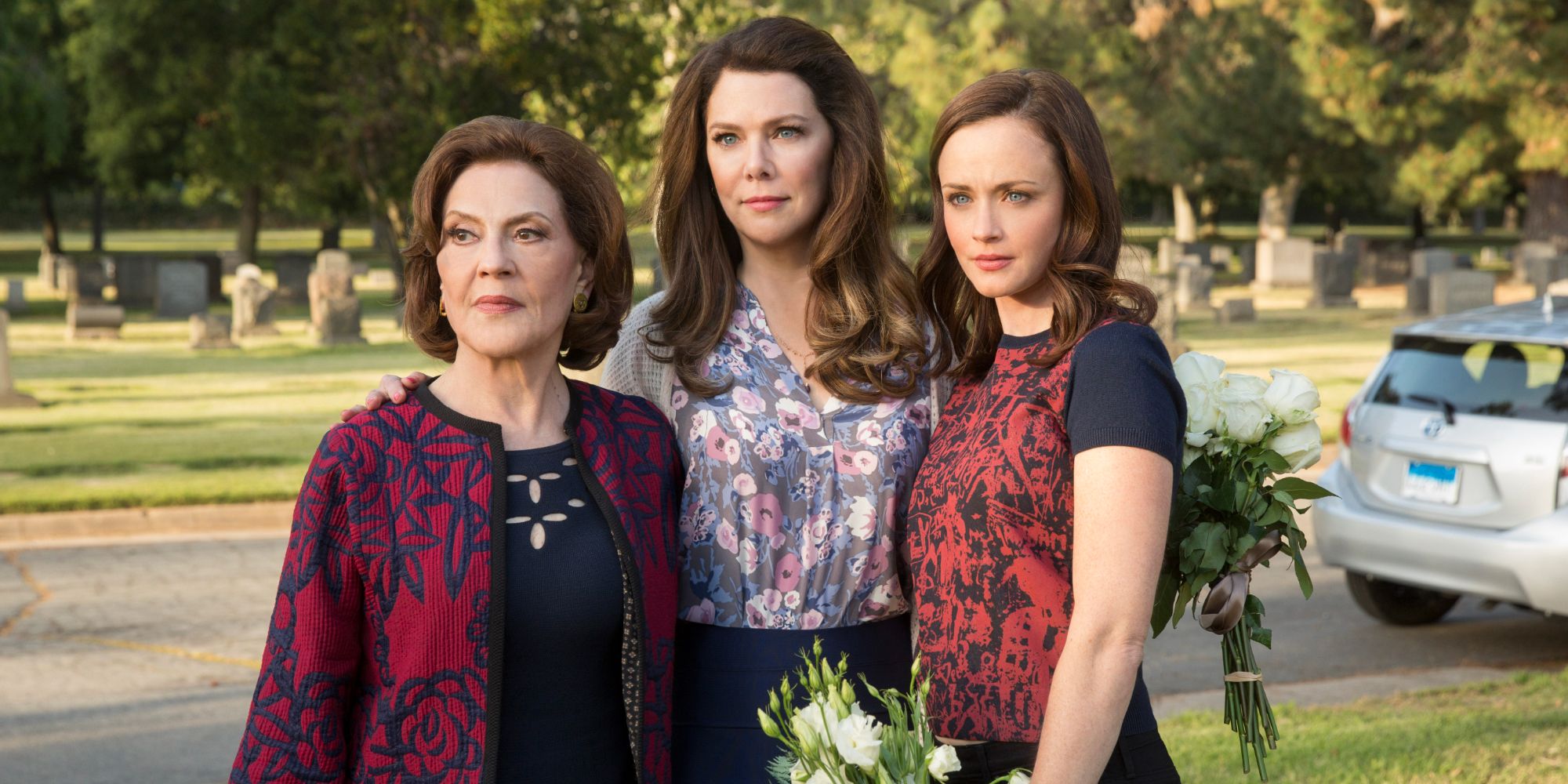 Kelly Bishop, Lauren Graham, and Alexis Bledel as Emily, Lorelai, and Rory at the cematary in Gilmore Girls A Year In The Life