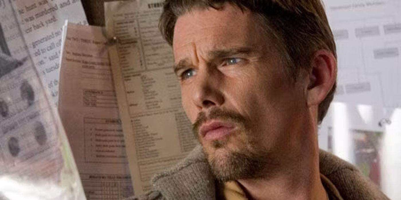 Ethan Hawke looking at papers in Sinister