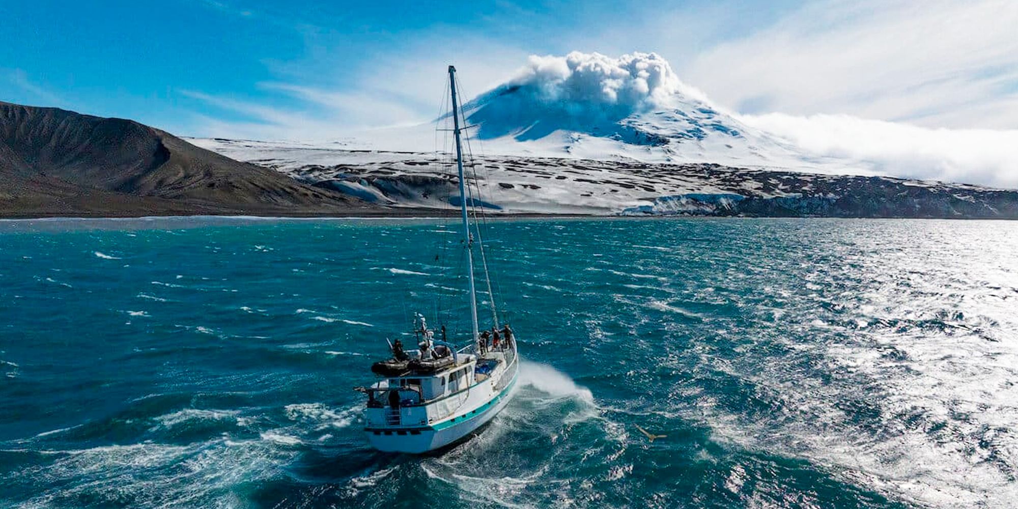 explorer lake of fire boat approaches mountain
