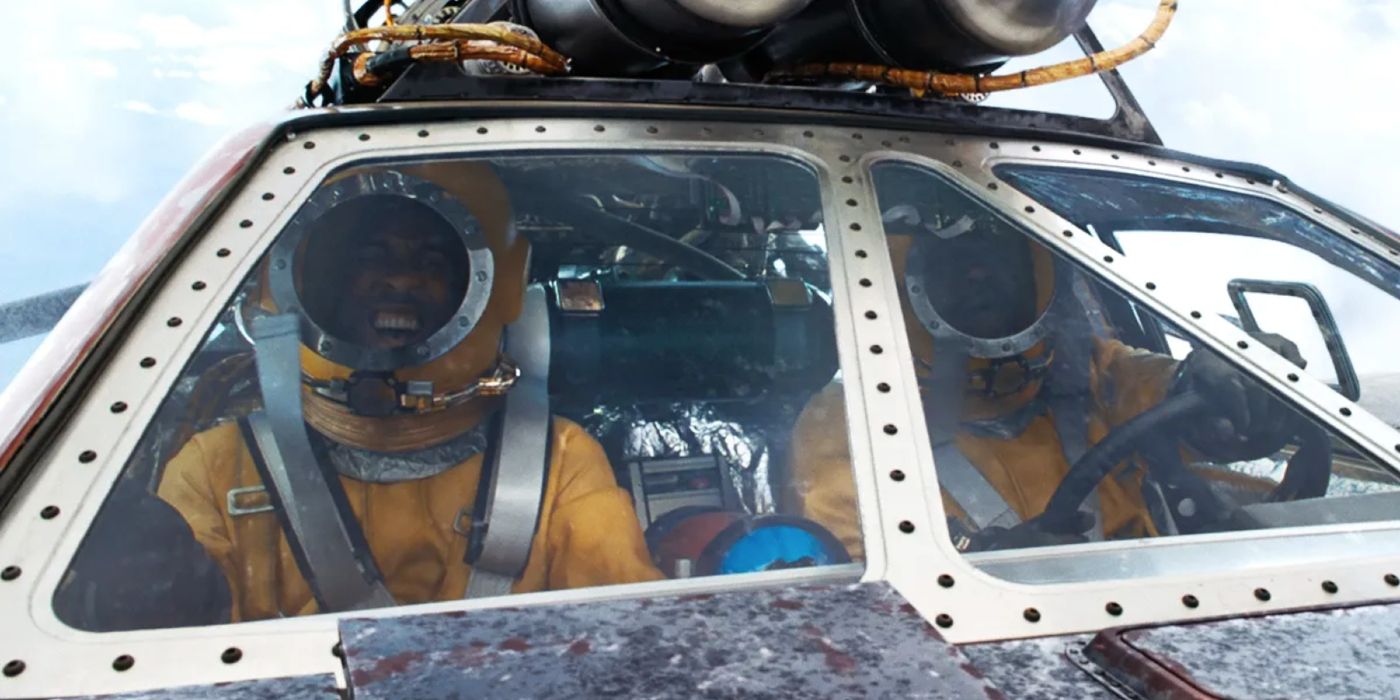 Roman and Tej wearing space suits in a Pontiac Fiero in F9.