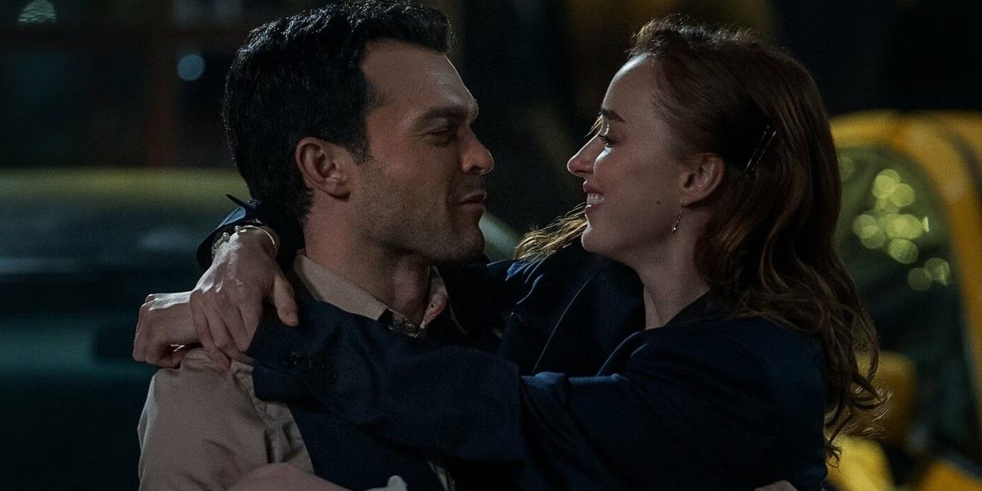 Alden Ehrenreich carrying Phoebe Dynevor in Fair Play