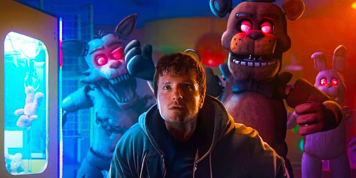 Josh Hutcherson as Mike Schmidt running from some animatronic mascots in the Five Nights at Freddy's movie