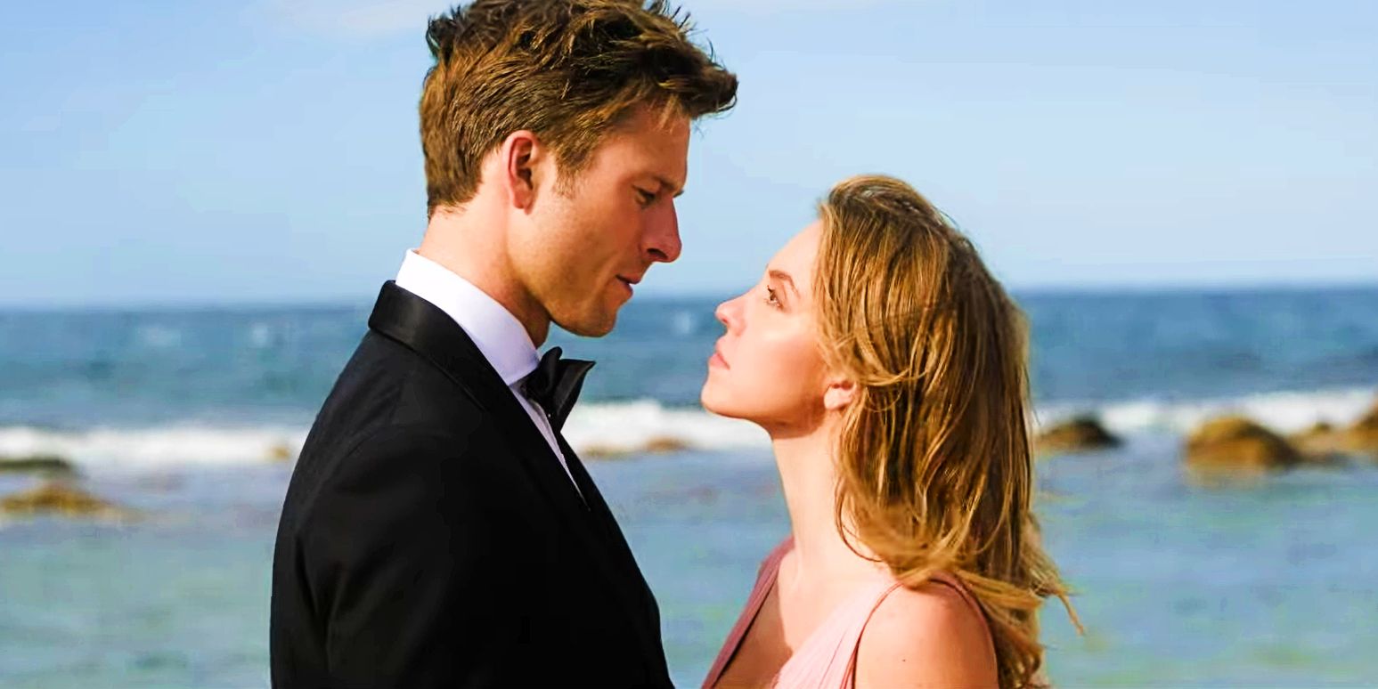 Glen Powell and Sydney Sweeney star lovingly into each other's eyes on a beach in Anyone But You.